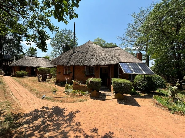 Thatched Home On An Acre