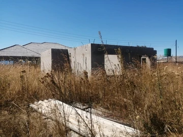 Land with cottage at roof level