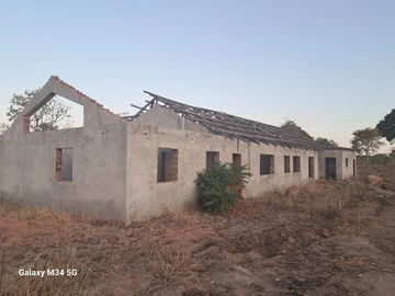 Incomplete house on roof level. 